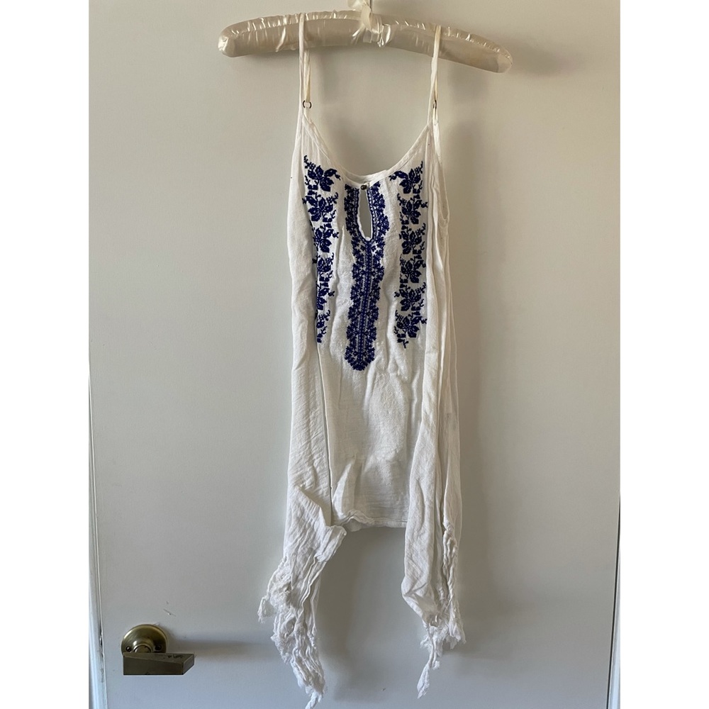 White top with navy blue embroidery